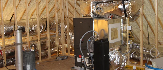 Residential heating system installed in attic.